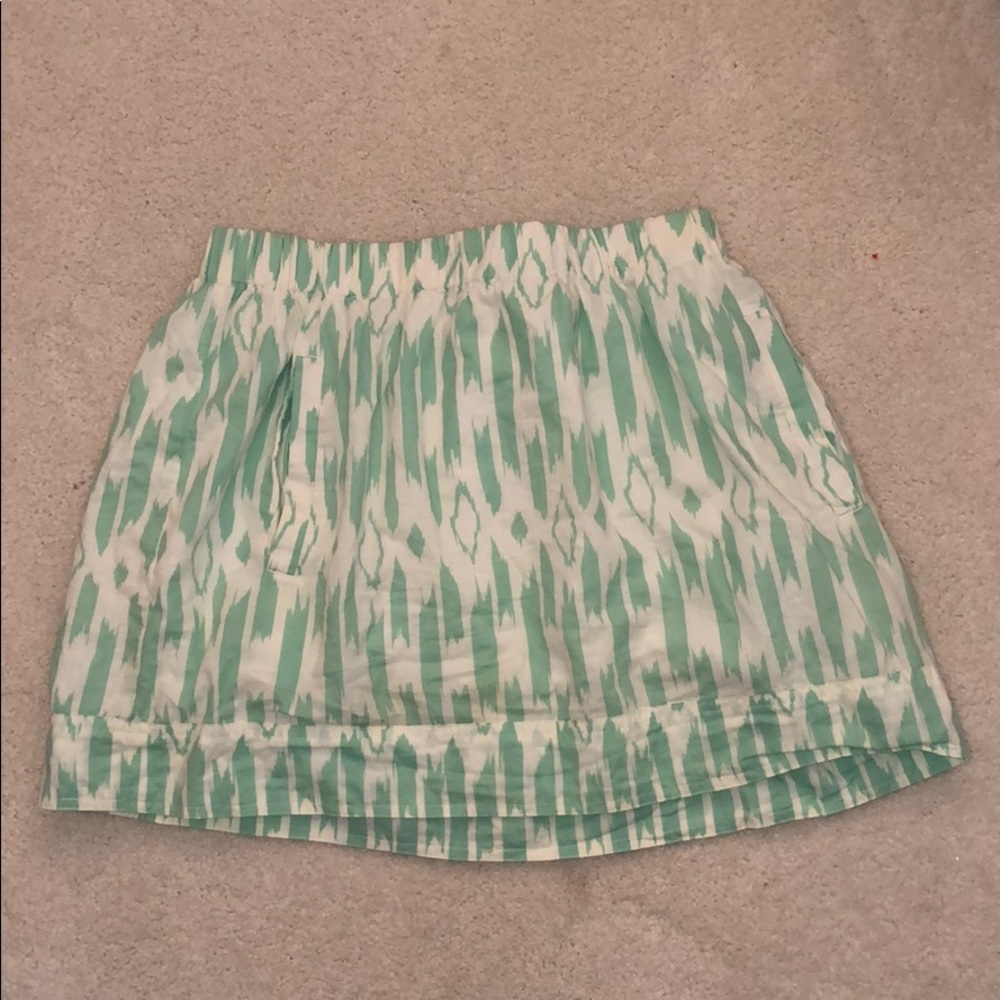 Green and white print skirt